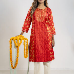 Bright red dress with a model standing with a flower prop
