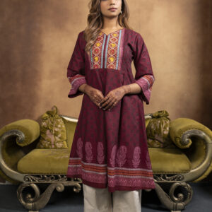 Home It is a chambray cotton kurti, a model is posing in a studio setup