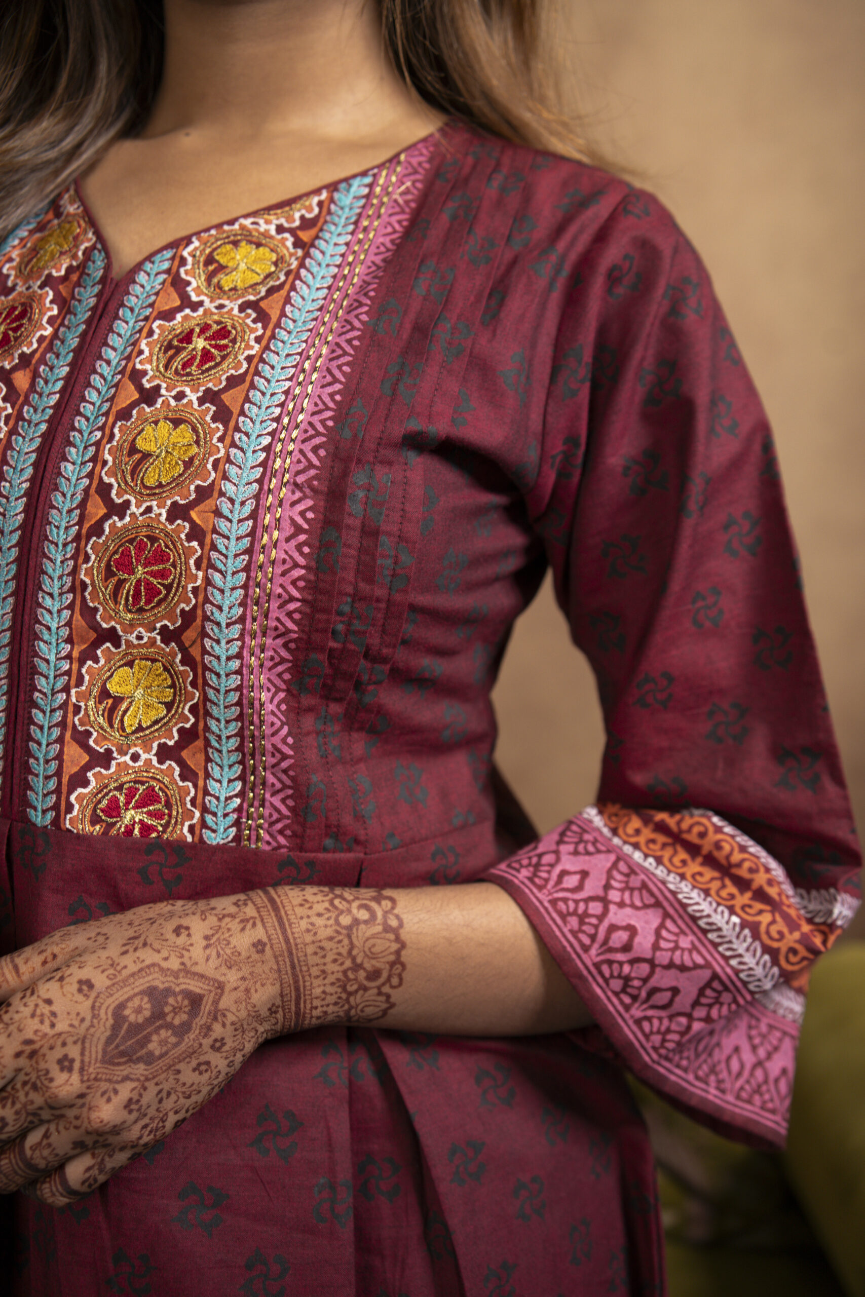Phool Kurti It is a chambray cotton kurti, a model is posing in a studio setup